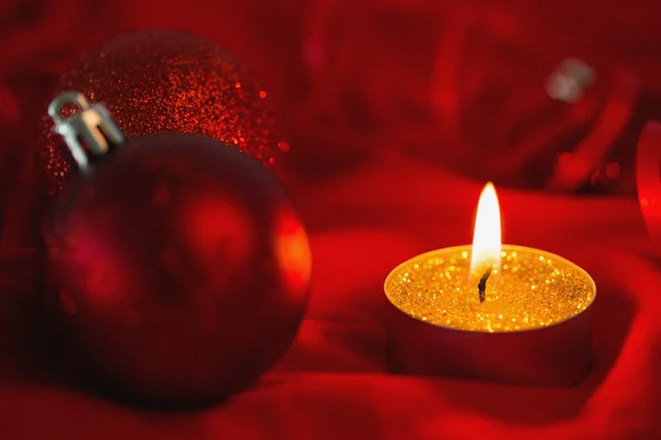 Golden tea light candle with christmas decorations