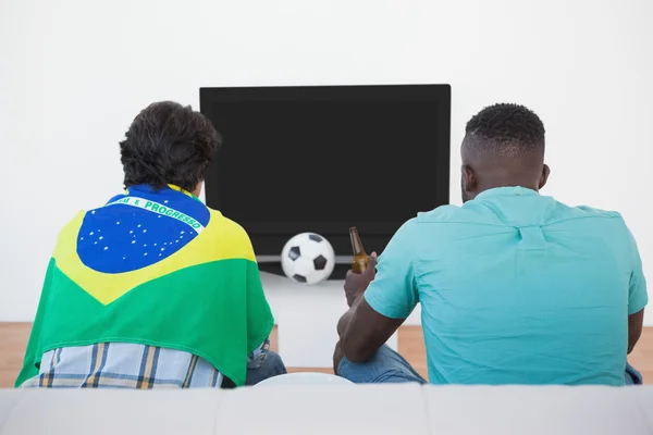 Brazilian soccer fans watching tv