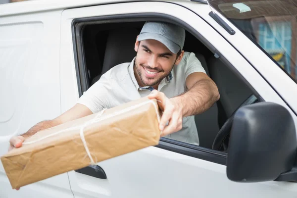 Delivery driver offering parcel