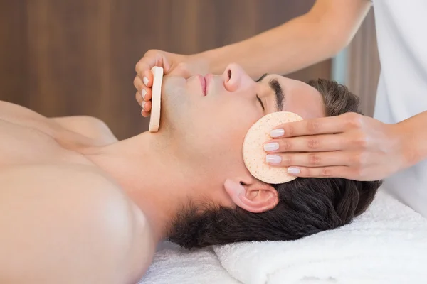 Man receiving facial massage