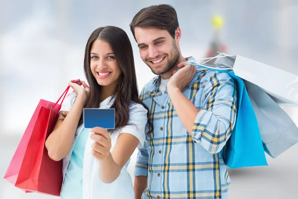 Couple with shopping bags and credit card
