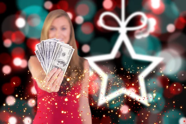 Composite image of pretty blonde showing wad of cash