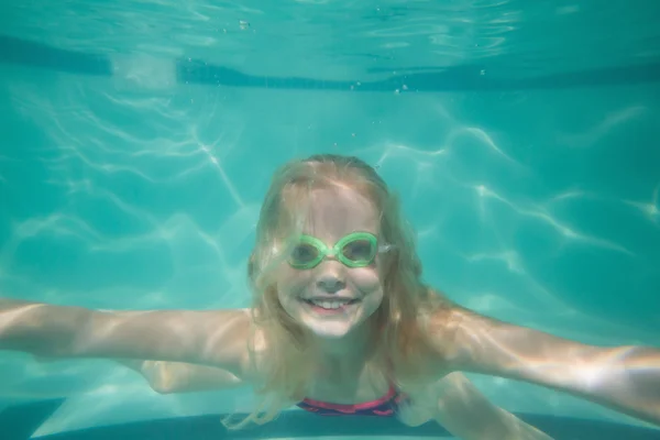 Cute kid posing underwater in pool