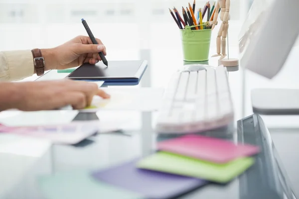 Designer working at desk using digitizer