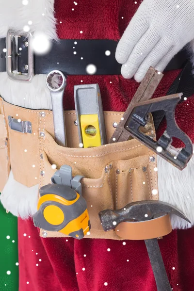 Father Christmas is wearing tool belt