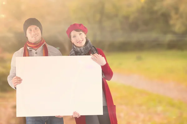 Couple holding a large sign