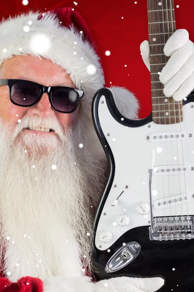 Father Christmas shows guitar