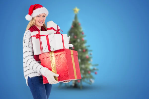 Blonde holding pile of gifts