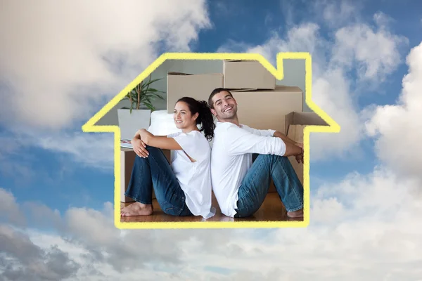 Bright couple with unpacking boxes moving