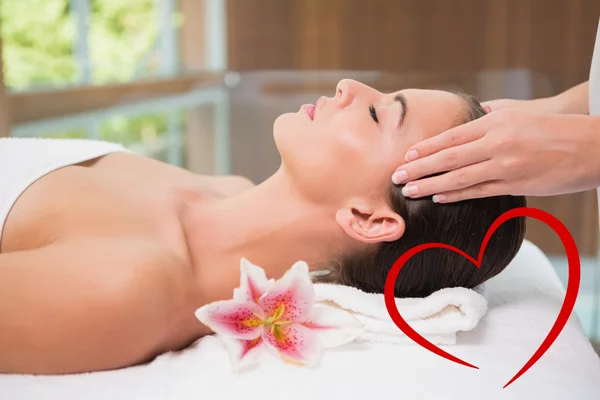 Attractive woman receiving head massage