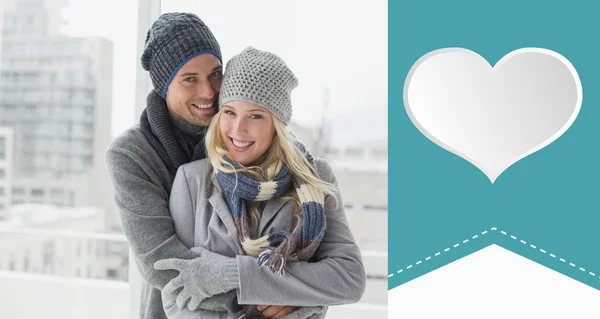 Couple in warm clothing smiling