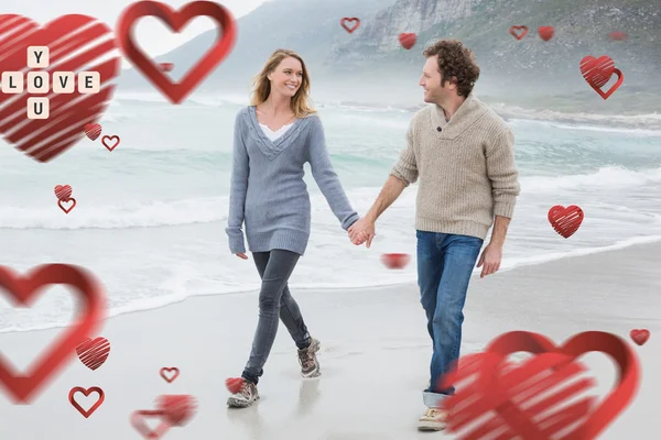 Couple holding hands and walking at beach