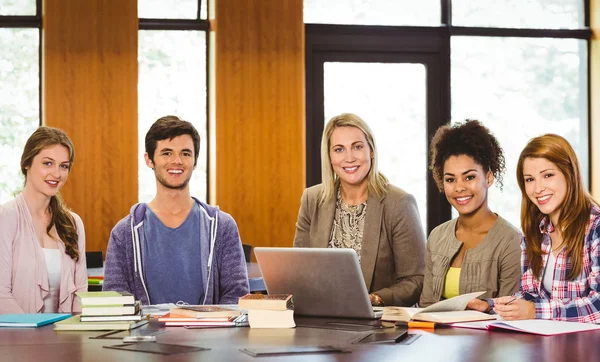 Students with teacher and laptop