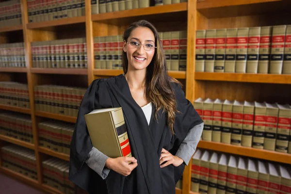 Pretty lawyer looking at camera in the law library