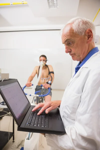 Man doing fitness test on exercise bike