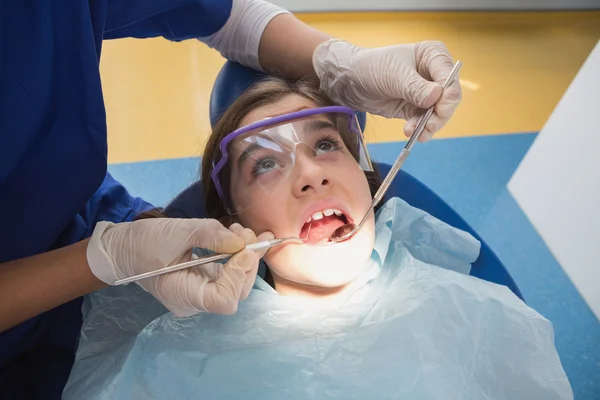 Young patient wearing safety glasses during the examination