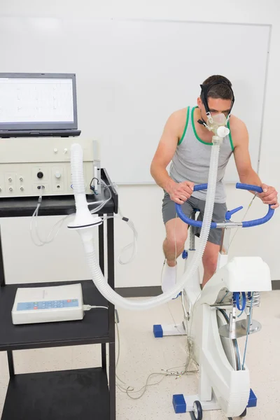 Man doing fitness test on exercise bike