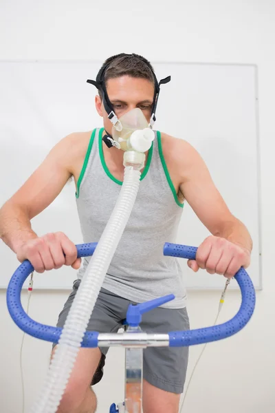 Man doing fitness test on exercise bike