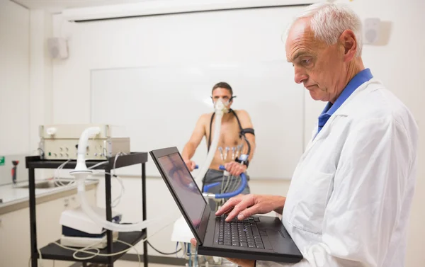 Man doing fitness test on exercise bike