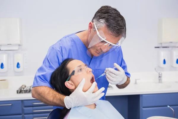 Dentist wearing face shield