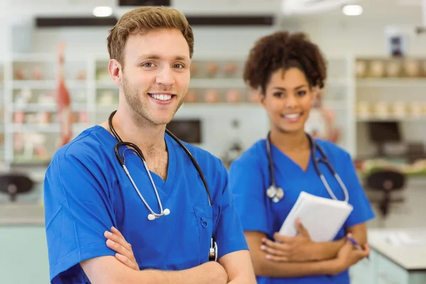 Young medical students smiling at the camera