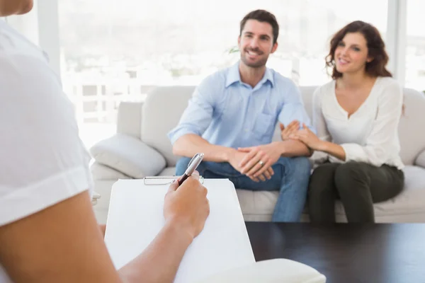 Reconciled couple talking with therapist