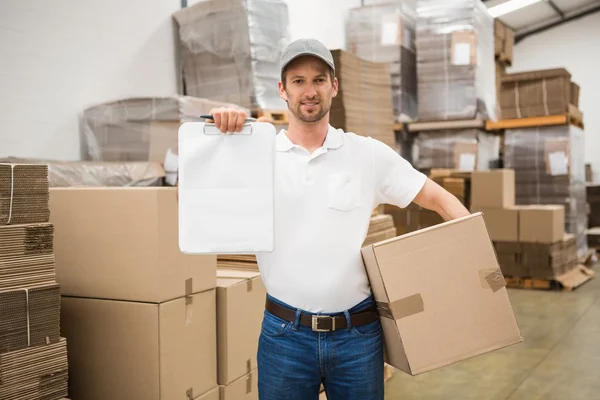 Delivery man with box and clipboard