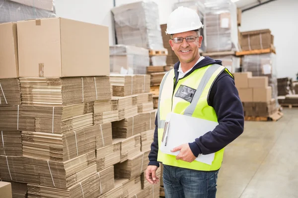 Warehouse worker with clipboard