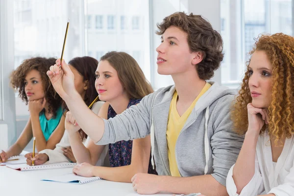 Fashion students being attentive in class