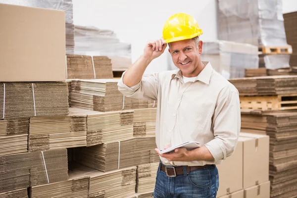 Warehouse worker with clipboard