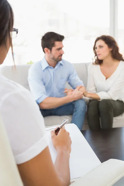 Couple talking with their psychologist