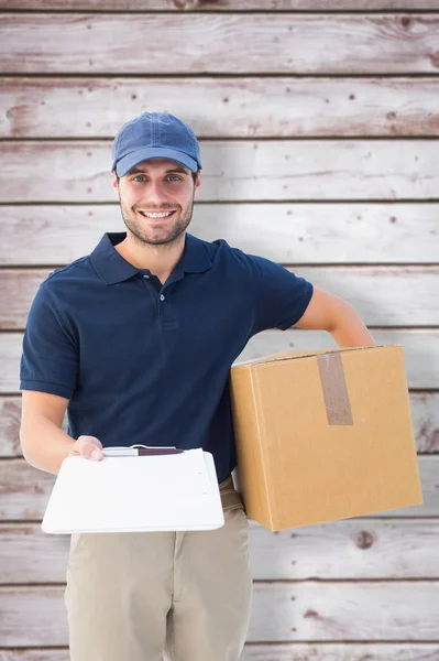 Happy delivery man with cardboard box