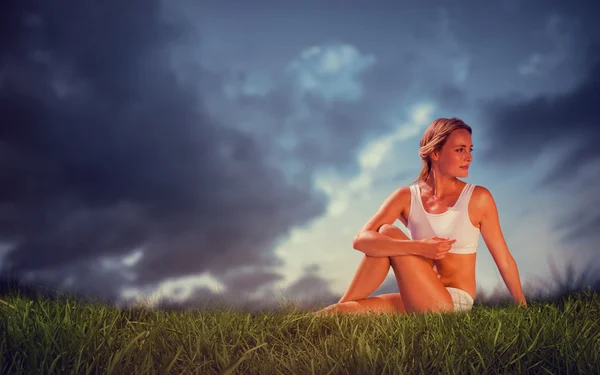 Fit blonde in seated yoga pose