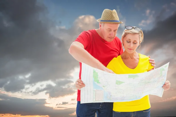 Tourist couple using map