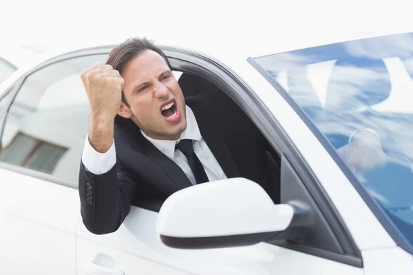 Businessman experiencing road rage