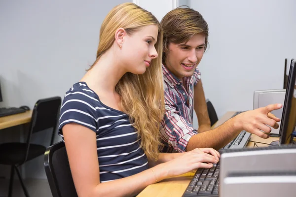 Students working together on computer