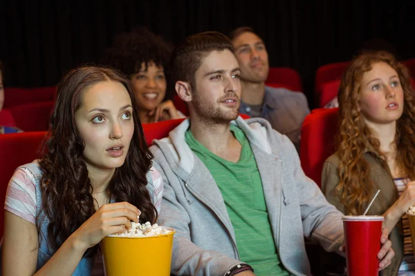 Young couple watching a film