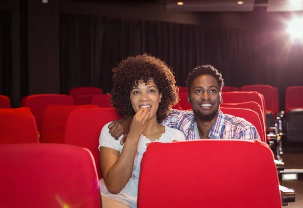 Young couple watching a film