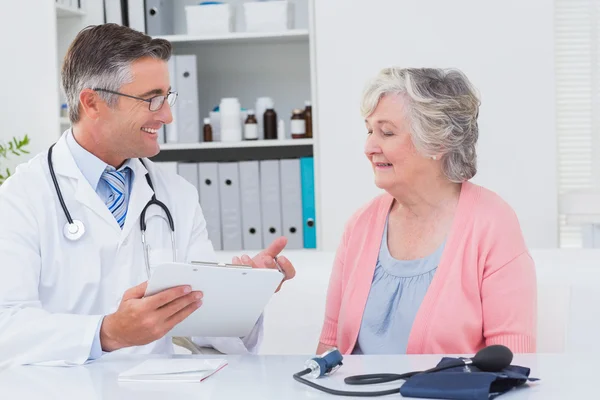 Doctor explaining prescriptions to patient