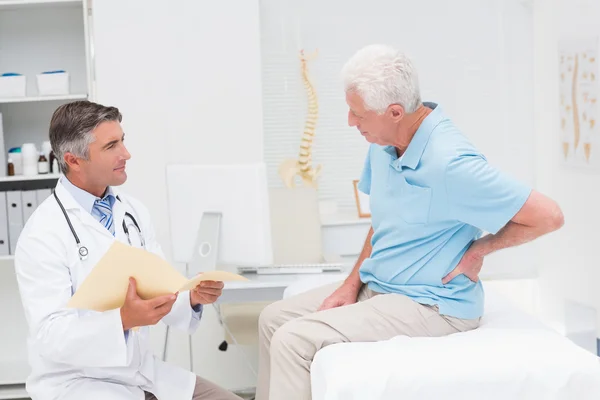 Doctor discussing reports with patient