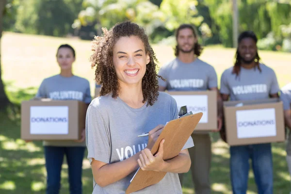 Happy volunteers in the park