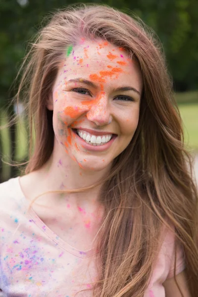Woman having fun with powder paint