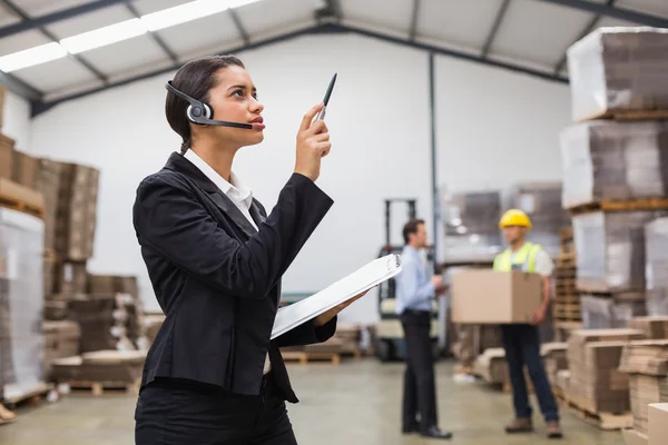 Warehouse manager checking inventory