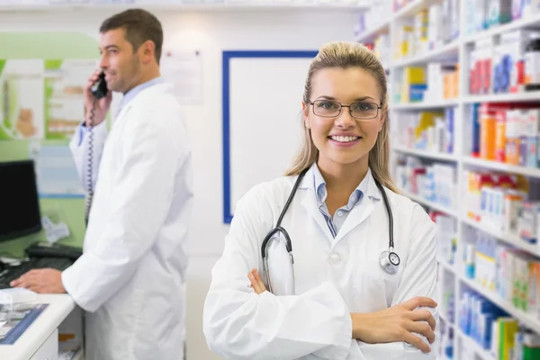 Pharmacist smiling with Pharmacist on the phone