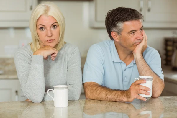 Couple having coffee together not talking