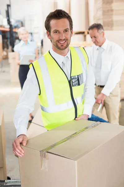 Delivery driver loading van with boxes