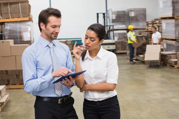 Focused warehouse managers working