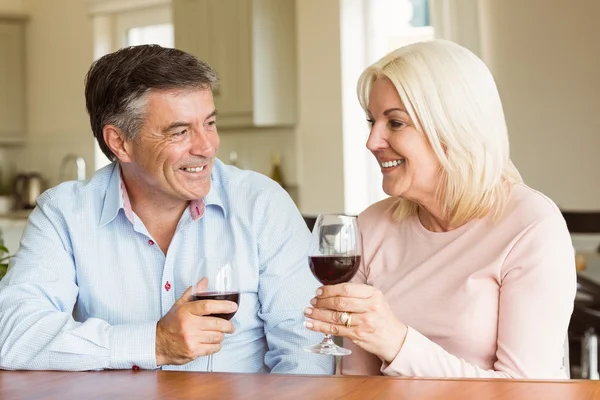 Mature couple drinking red wine