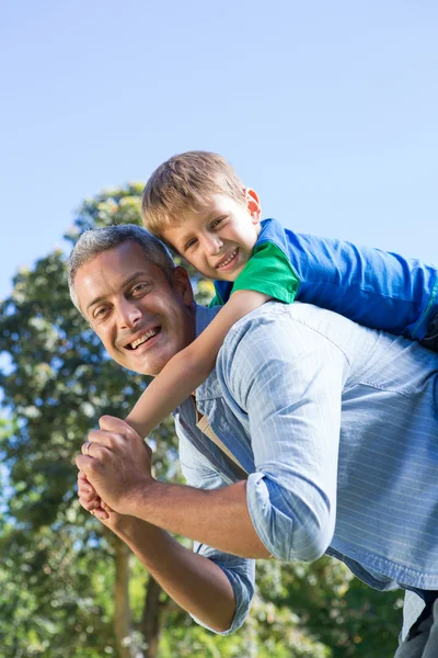 Father and son having fun in the park