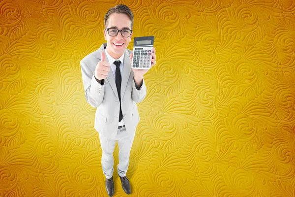 Geeky smiling businessman showing calculator